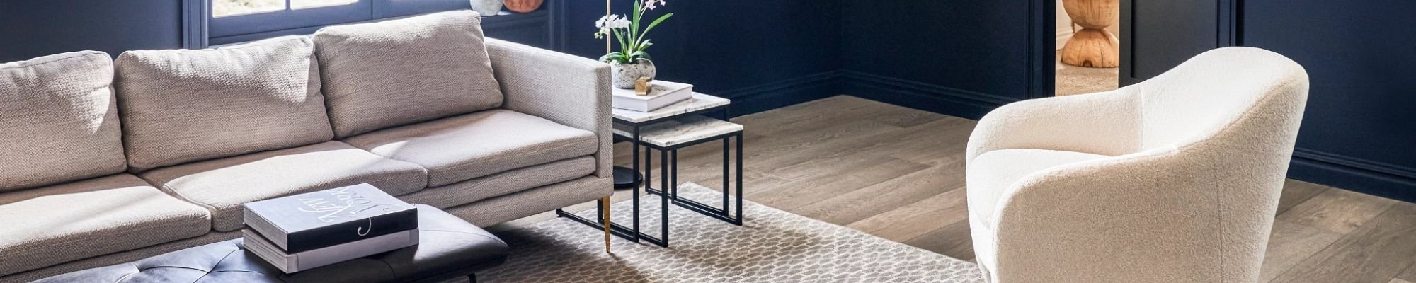 Living room with hard floor and area rug - Lacey's The Carpetmaster in VT