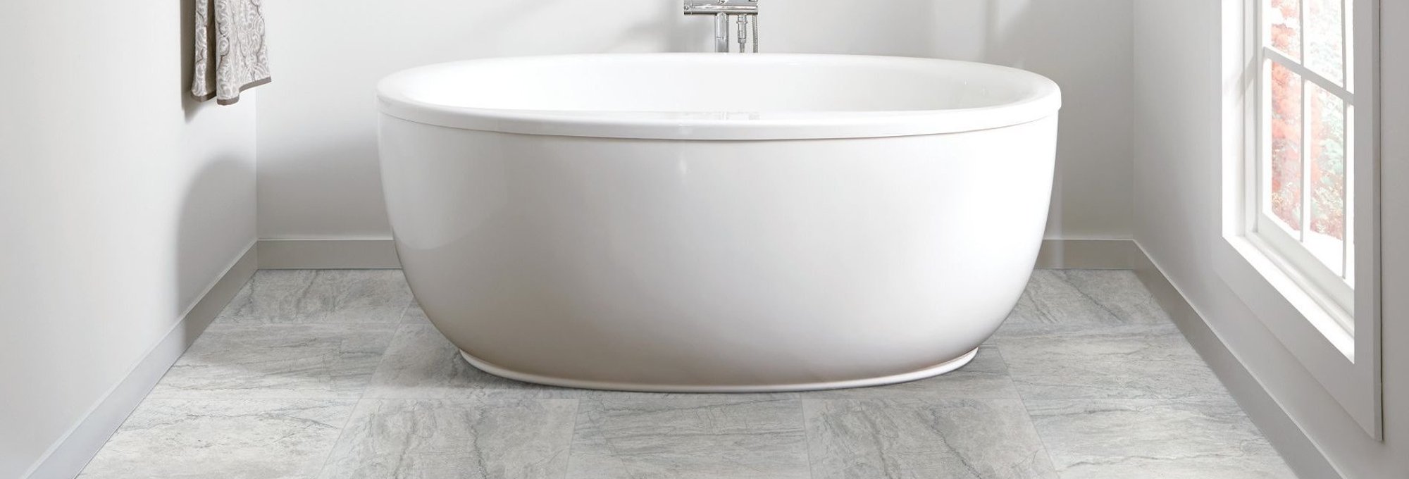 Bathroom with standalone tub and tiles - Lacey's The Carpetmaster in VT